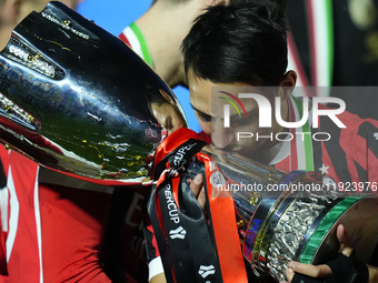 Ismael Bennacer defensive midfield of AC Milan and Algeria  celebrates with the trophy after winning the EA SPORTS FC SUPERCUP 24/25 final m...