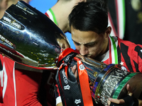 Ismael Bennacer defensive midfield of AC Milan and Algeria  celebrates with the trophy after winning the EA SPORTS FC SUPERCUP 24/25 final m...