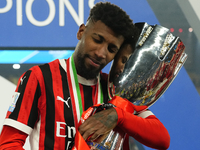 Emerson Royal right-back of AC Milan and Brazil celebrates with the trophy after winning the EA SPORTS FC SUPERCUP 24/25 final match between...