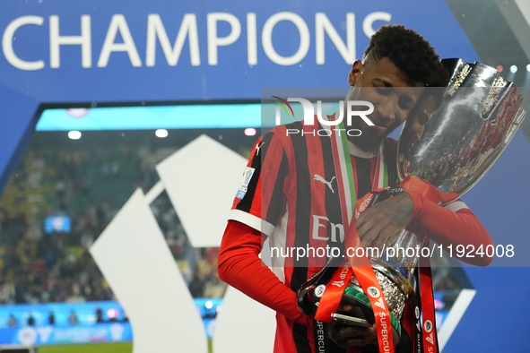 Emerson Royal right-back of AC Milan and Brazil celebrates with the trophy after winning the EA SPORTS FC SUPERCUP 24/25 final match between...