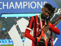 Emerson Royal right-back of AC Milan and Brazil celebrates with the trophy after winning the EA SPORTS FC SUPERCUP 24/25 final match between...