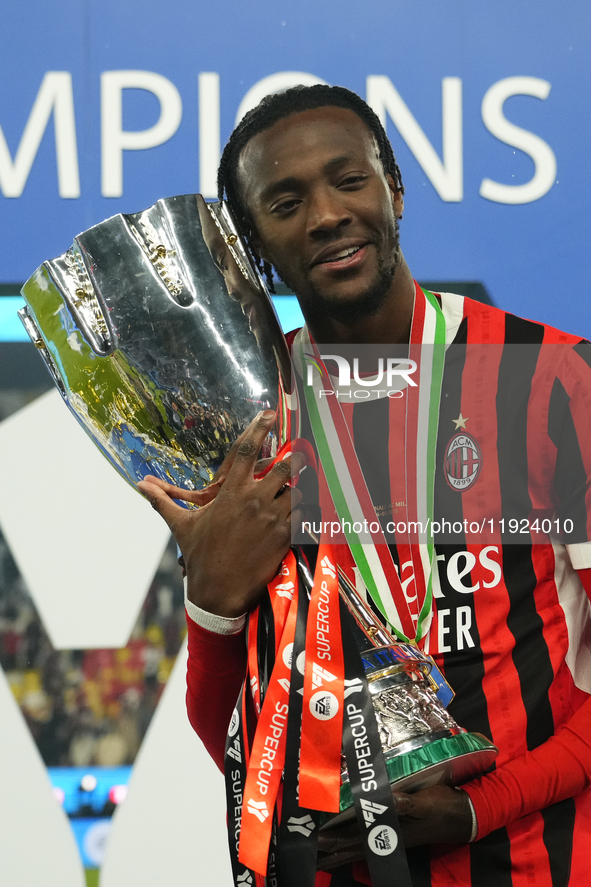 Tammy Abraham centre-forward of AC Milan and England celebrates with the trophy after winning the EA SPORTS FC SUPERCUP 24/25 final match be...