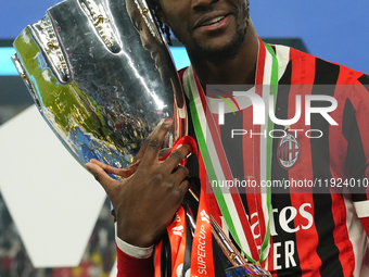 Tammy Abraham centre-forward of AC Milan and England celebrates with the trophy after winning the EA SPORTS FC SUPERCUP 24/25 final match be...