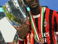 Tammy Abraham centre-forward of AC Milan and England celebrates with the trophy after winning the EA SPORTS FC SUPERCUP 24/25 final match be...