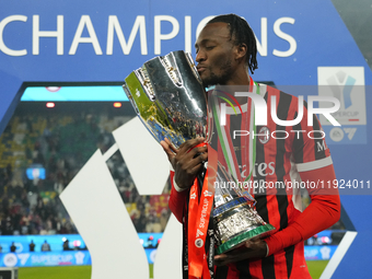 Tammy Abraham centre-forward of AC Milan and England celebrates with the trophy after winning the EA SPORTS FC SUPERCUP 24/25 final match be...