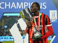 Tammy Abraham centre-forward of AC Milan and England celebrates with the trophy after winning the EA SPORTS FC SUPERCUP 24/25 final match be...