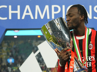 Tammy Abraham centre-forward of AC Milan and England celebrates with the trophy after winning the EA SPORTS FC SUPERCUP 24/25 final match be...