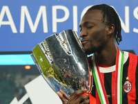 Tammy Abraham centre-forward of AC Milan and England celebrates with the trophy after winning the EA SPORTS FC SUPERCUP 24/25 final match be...