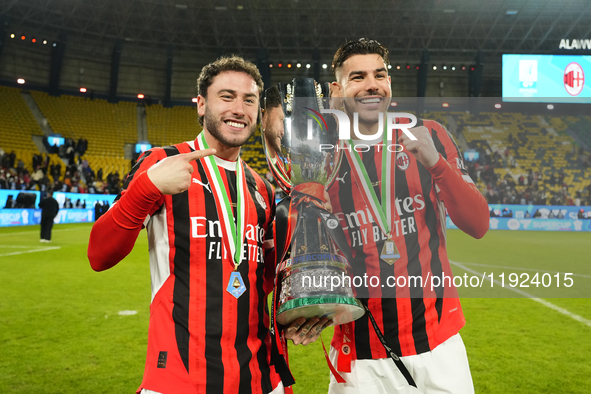 Davide Calabria right-back of AC Milan and Italy and Theo Hernandez left-back of AC Milan and France celebrate with the trophy after winning...