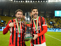 Davide Calabria right-back of AC Milan and Italy and Theo Hernandez left-back of AC Milan and France celebrate with the trophy after winning...