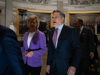 Newly elected Senator DAve McCormick (R-PA) (center right) talks with Senator Tina Smith (D-MN) en route to the House of Representatives for...