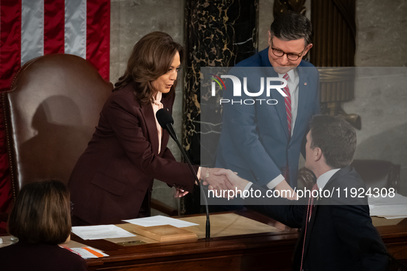 Vice President Kamala Harris shakes hands with Rep. Bryan Steil (R-WI) prior to certifying the 2024 presidential electoral vote in a joint s...