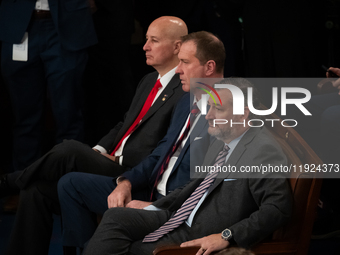 Senator Ted Cruz (R-TX) (right) sits in the front row during a joint session of Congress certifying the results of the 2024 presidential ele...