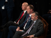 Senator Ted Cruz (R-TX) (right) sits in the front row during a joint session of Congress certifying the results of the 2024 presidential ele...