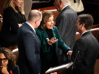 House Speaker Emerita Nancy Pelosi (D-CA) speaks with aides following the conclusion of a joint session of Congress certifying the results o...