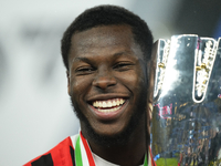 Yunus Musah central midfield of AC Milan and United States celebrates with the trophy after winning the EA SPORTS FC SUPERCUP 24/25 final ma...