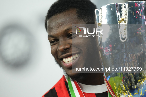 Yunus Musah central midfield of AC Milan and United States celebrates with the trophy after winning the EA SPORTS FC SUPERCUP 24/25 final ma...