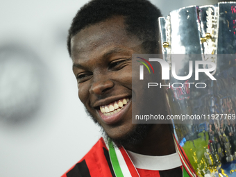 Yunus Musah central midfield of AC Milan and United States celebrates with the trophy after winning the EA SPORTS FC SUPERCUP 24/25 final ma...