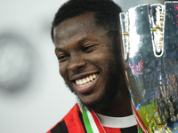 Yunus Musah central midfield of AC Milan and United States celebrates with the trophy after winning the EA SPORTS FC SUPERCUP 24/25 final ma...