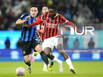 Lautaro Martinez centre-forward of Internazionale and Argentina and Youssouf Fofana defensive midfield of AC Milan and France compete for th...