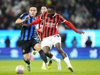 Lautaro Martinez centre-forward of Internazionale and Argentina and Youssouf Fofana defensive midfield of AC Milan and France compete for th...