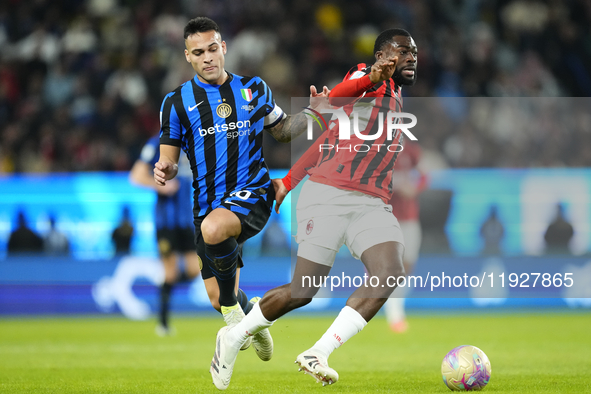 Lautaro Martinez centre-forward of Internazionale and Argentina and Youssouf Fofana defensive midfield of AC Milan and France compete for th...