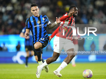 Lautaro Martinez centre-forward of Internazionale and Argentina and Youssouf Fofana defensive midfield of AC Milan and France compete for th...