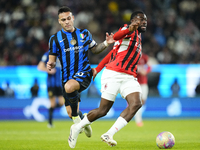 Lautaro Martinez centre-forward of Internazionale and Argentina and Youssouf Fofana defensive midfield of AC Milan and France compete for th...