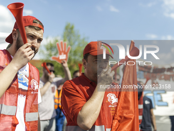 Employees of the Dailmer have gathered for a warning strike rally in front of the entrance to the company's plant in Berlin, Germany, 11 May...