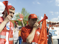 Employees of the Dailmer have gathered for a warning strike rally in front of the entrance to the company's plant in Berlin, Germany, 11 May...