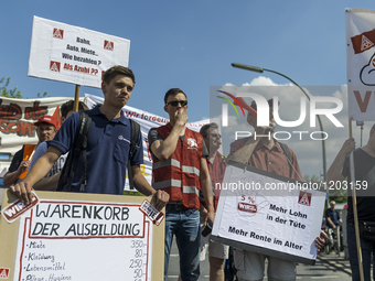 Employees of the Dailmer have gathered for a warning strike rally in front of the entrance to the company's plant in Berlin, Germany, 11 May...