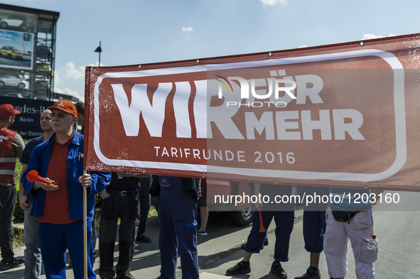 Porsche employees rally in support of the demands made by German union IG Metall in the ongoing collective wage negotiations, during a warni...