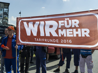 Porsche employees rally in support of the demands made by German union IG Metall in the ongoing collective wage negotiations, during a warni...