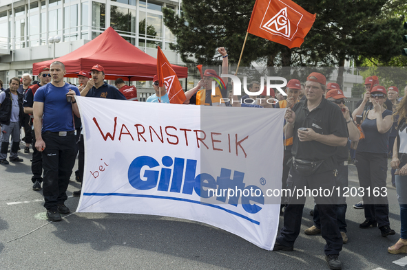 Gillette employees rally in support of the demands made by German union IG Metall in the ongoing collective wage negotiations, during a warn...