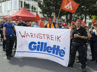 Gillette employees rally in support of the demands made by German union IG Metall in the ongoing collective wage negotiations, during a warn...