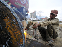 SUDHIR KUMAR PATEL, 28 yrs old, migrated from India Cutting heavy duty roller's Metal with Oxygen Acetylene Gas as Spark splash around the g...