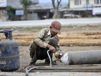 SUDHIR KUMAR PATEL, 28 yrs old, migrated from India changing Oxygen gas cylinder to cut heavy duty roller with Oxygen Acetylene Gas as Spark...