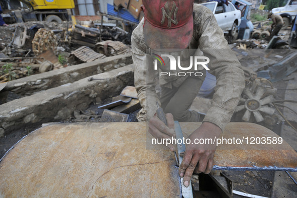 SUDHIR KUMAR PATEL, 28 yrs old, migrated from India marking on shifted heavy duty roller's to cut with Oxygen Acetylene Gas as Spark splash...