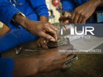 Students of the Automechanical course assemble starter motor during their practical lesson at workshop in the Windhoek Vocational Training C...