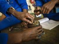 Students of the Automechanical course assemble starter motor during their practical lesson at workshop in the Windhoek Vocational Training C...