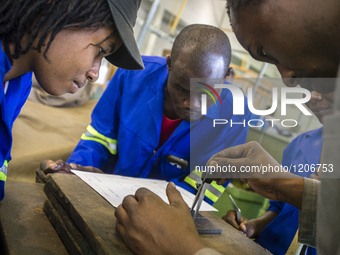 Fitting and Turning Trade of the Windhoek Vocational Training Centre, Namibia, on May 12, 2016. Students practice in making steel details. (