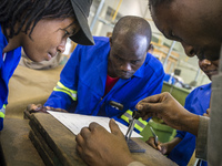 Fitting and Turning Trade of the Windhoek Vocational Training Centre, Namibia, on May 12, 2016. Students practice in making steel details. (