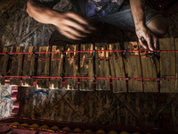 A worker checking gendher penerus in Gamelan Daliyo Legiyono, Pelem Lor Batu Retno Village, Banguntapan, Yogyakarta, Indonesia, on May 13, 2...