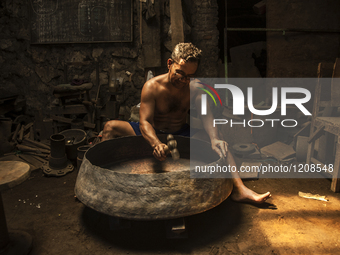 A worker forge gamelan in Gamelan Daliyo Legiyono, Pelem Lor Batu Retno Village, Banguntapan, Yogyakarta, Indonesia, on May 13, 2016. Gamela...