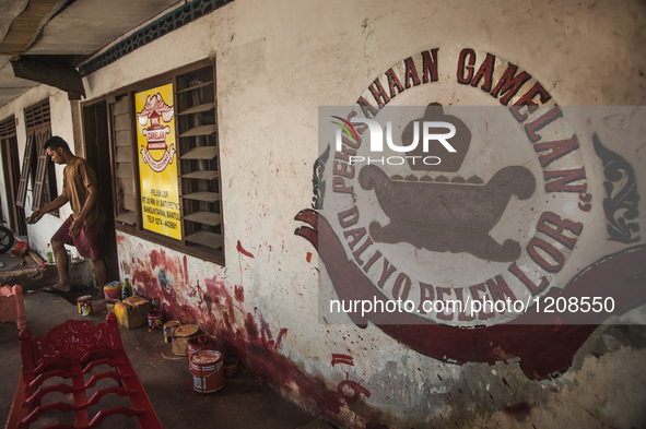 A worker walking  in Gamelan Daliyo Legiyono, Pelem Lor Batu Retno Village, Banguntapan, Yogyakarta, Indonesia, on May 13, 2016. Gamelan Dal...