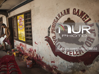 A worker walking  in Gamelan Daliyo Legiyono, Pelem Lor Batu Retno Village, Banguntapan, Yogyakarta, Indonesia, on May 13, 2016. Gamelan Dal...