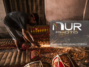 A worker welding gendher penerus in Gamelan Daliyo Legiyono, Pelem Lor Batu Retno Village, Banguntapan, Yogyakarta, Indonesia, on May 13, 20...