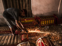 A worker welding gendher penerus in Gamelan Daliyo Legiyono, Pelem Lor Batu Retno Village, Banguntapan, Yogyakarta, Indonesia, on May 13, 20...