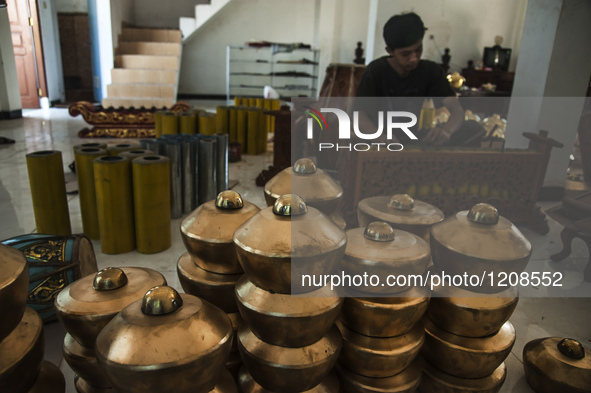 A worker checking gendher penerus in Gamelan Daliyo Legiyono, Pelem Lor Batu Retno Village, Banguntapan, Yogyakarta, Indonesia, on May 13, 2...