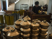 A worker checking gendher penerus in Gamelan Daliyo Legiyono, Pelem Lor Batu Retno Village, Banguntapan, Yogyakarta, Indonesia, on May 13, 2...